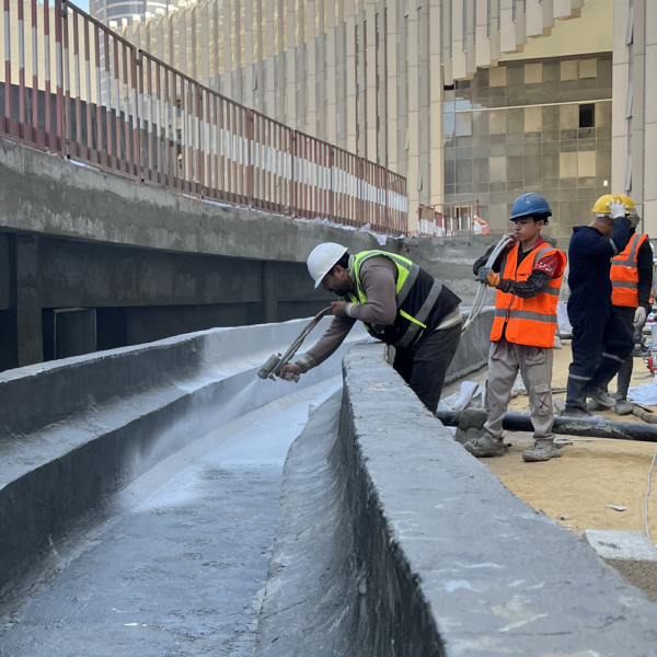 Technician Applying Polyurea Krypton Chemical to Planting Basins – Iconic Tower Egypt