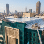 Modern building receiving advanced waterproofing treatment for structural protection.