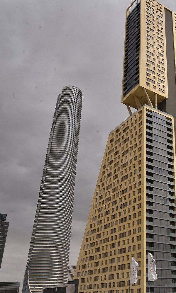 Modern high-rise buildings in Egypt's New Administrative Capital under a cloudy sky, symbolizing new infrastructure and construction challenges.