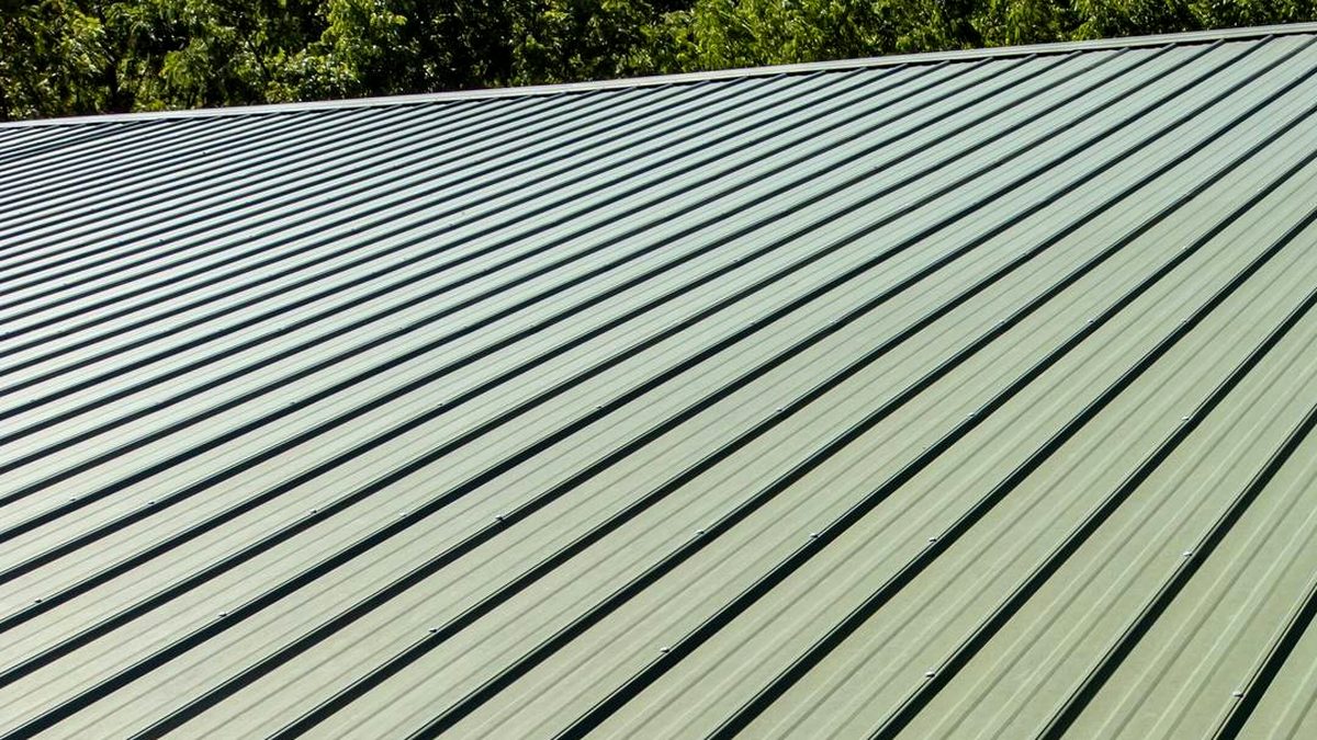 Corrugated metal roof with visible fasteners before metal roof waterproofing